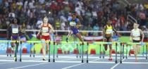 2016 Rio Olympics - Athletics - Final - Women's 400m Hurdles Final - Olympic Stadium - Rio de Janeiro, Brazil - 18/08/2016. Dalilah Muhammad (USA) of USA crosses the hurdle. REUTERS/Lucy Nicholson