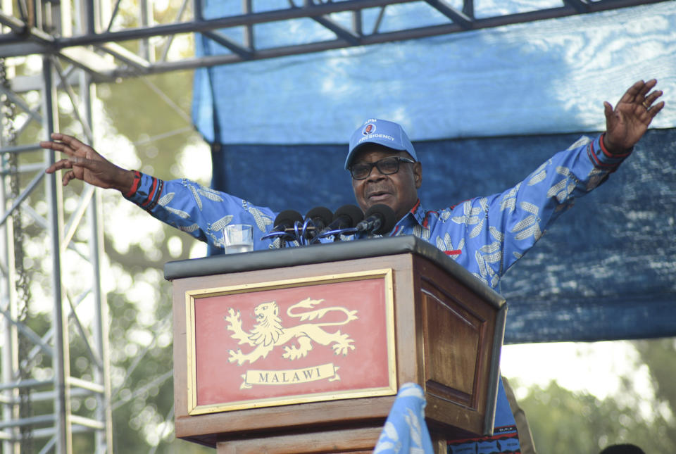Malawian President Peter Mutharika addresses his party's Democratic Progressive Party (DPP) final election rally in Blantyre, Malawi Saturday, May 18, 2019. Corruption and the need for economic growth are the main campaign issues as Malawi goes to the polls on Tuesday for a presidential election that pits the incumbent 78-year-old president Peter Mutharika of the ruling Democratic Progressive Party against his own vice president, 46-year-old Saulos Chilima as well as the main opposition party leader Lazarus Chakwera, 64. (AP Photo/Thoko Chikondi)