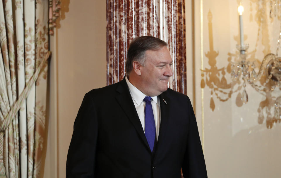 Secretary of State Mike Pompeo stands on stage during the announcement of the World Food Prize Laureate at the State Department, Monday, June 10, 2019. Simon N. Groot of the Netherlands, founder of East-West Seed, will receive the 2019 World Food Prize. (AP Photo/Pablo Martinez Monsivais)