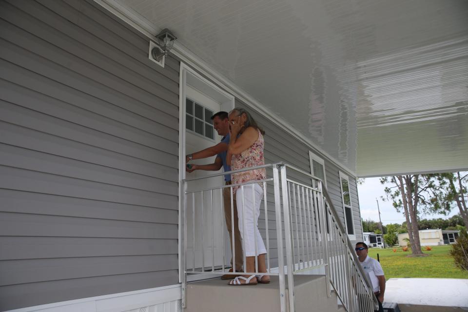 Rose Marie Powell reacts at the unveiling of her new manufactured home in Naples. Her original home was severely damaged in Hurricane Ian. Powell is one of five seniors who qualified for a new manufactured home courtesy of the Collier Community Foundation and the Baker Senior Center Naples which collaborated to get seniors who meet qualifications into resilient housing after Ian.