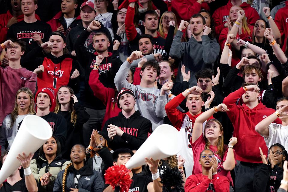 Cincinnati Bearcats fans cheer their team's 81-77 overtime win over TCU Tuesday night.