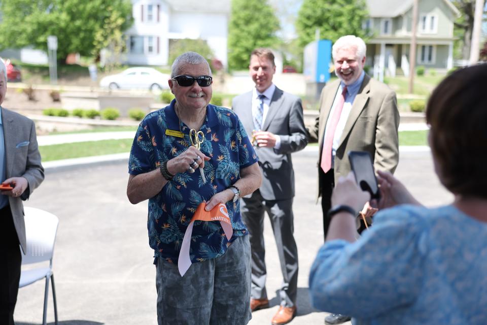 Cuyahoga Falls resident Kenny King helped with the ribbon cutting of Summit County Developmental Disabilities Board's Cuyahoga Falls location on Second Street.