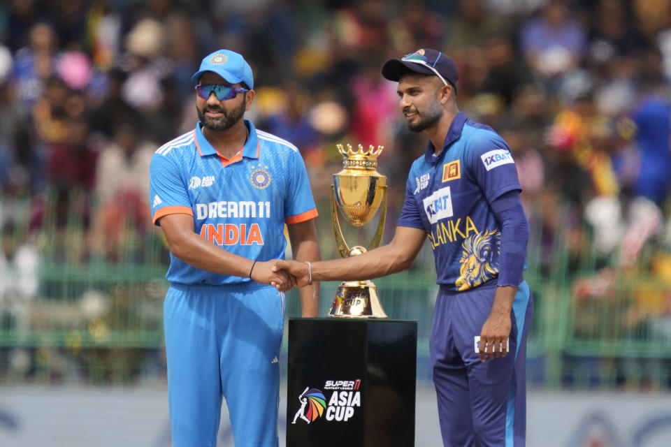 India's captain Rohit Sharma and his Sri Lankan counter part Dasun Shanaka pose for photographs with trophy before the start of the Asia Cup final cricket match between India and Sri Lanka in Colombo, Sri Lanka, Sunday, Sep. 17, 2023. (AP Photo/Eranga Jayawardena)