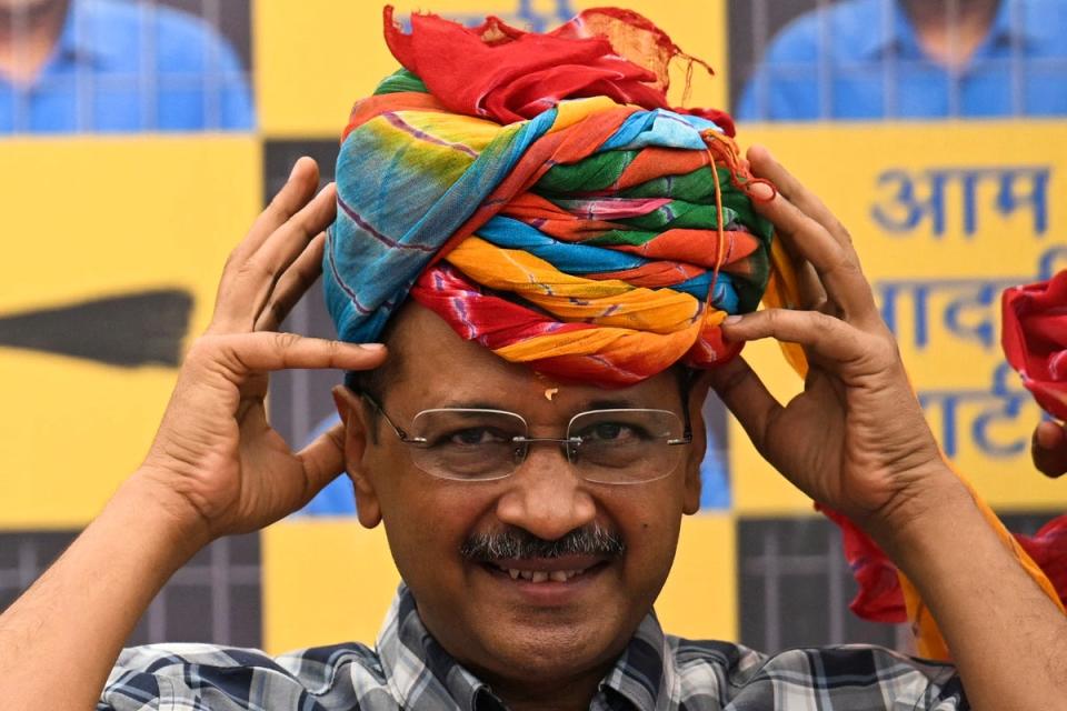 The freed politician puts on a turban during a press conference at party HQ in New Delhi, a day after his release (Getty)