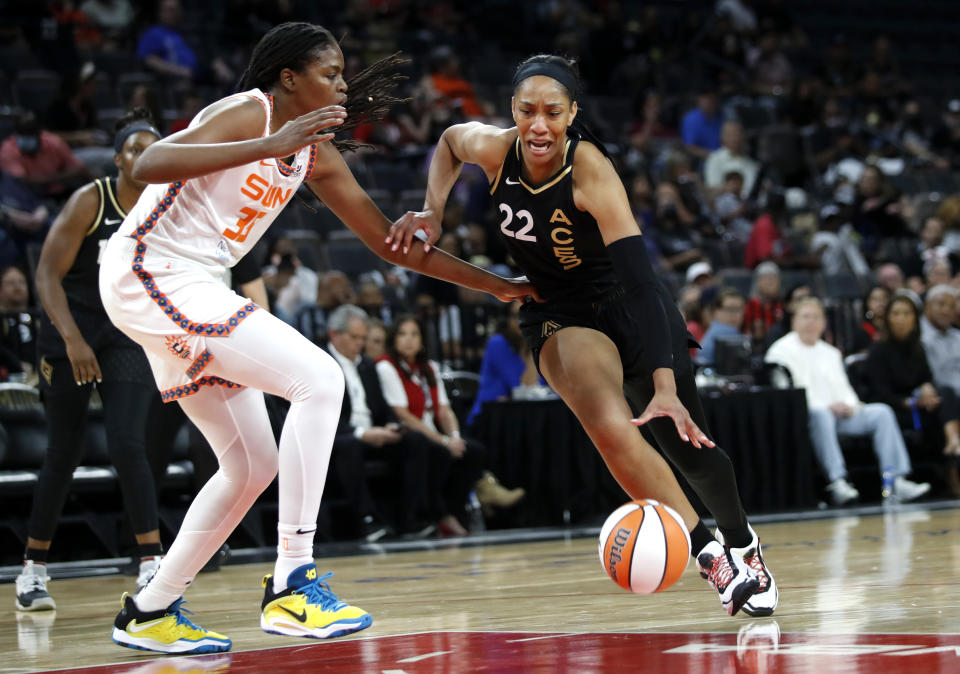 Las Vegas Aces forward A'ja Wilson (22) drives against Connecticut Sun forward Jonquel Jones (35) during a WNBA basketball game in Las Vegas on Thursday, June 2, 2022. (Steve Marcus/Las Vegas Sun via AP)