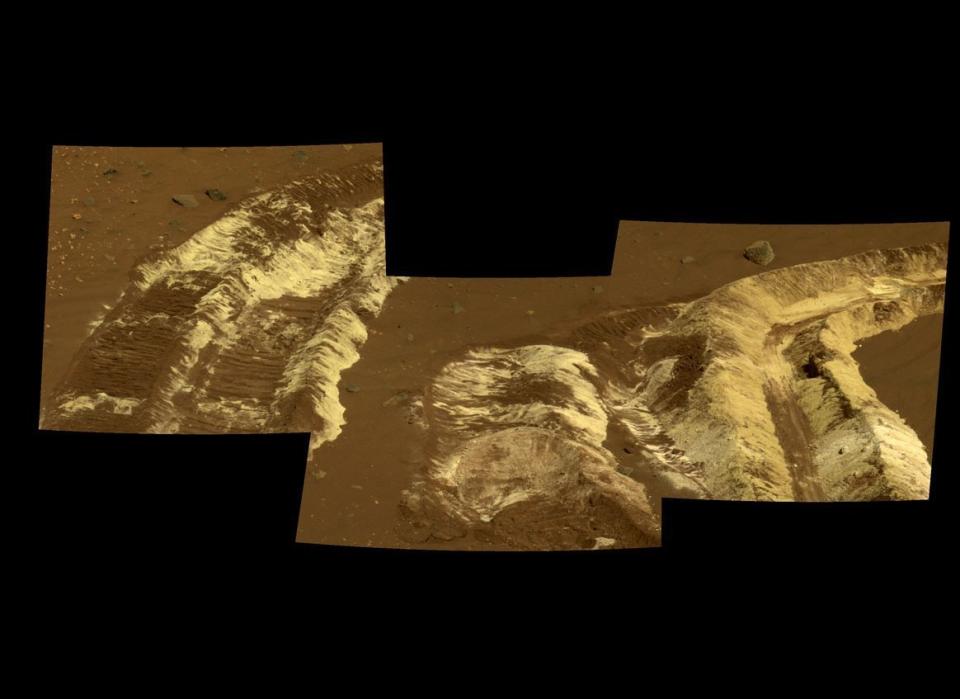 This Spirit Pancam sol 788 (April 12, 2006) mosaic shows a dramatic example of whiteish and yellowish salty soils dug up by the rover's wheels in what may once have been a hydrothermal vent near the ancient volcanic feature called Home Plate.     <em>From "Postcards from Mars" by Jim Bell; Photo credit: NASA/JPL/Cornell University</em>  