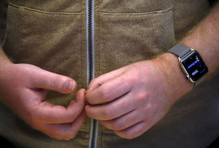 A customer wears an Apple Watch after it went on display at the Apple store in Sydney April 10, 2015. REUTERS/David Gray