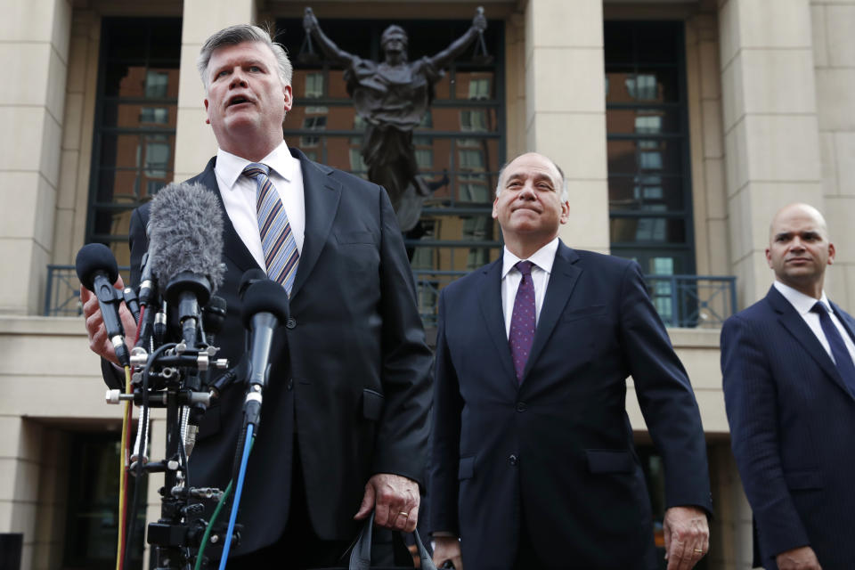Defense attorney Kevin Downing, left, with Thomas Zehnle and Jay Nanavati, right, makes a statement to the media outside federal court after closing arguments and jury instructions ended in the trial of the former Donald Trump campaign chairman, in Alexandria, Va., Wednesday, Aug. 15, 2018. (AP Photo/Jacquelyn Martin)