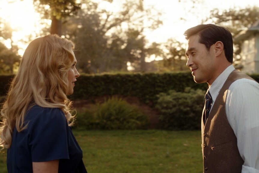 Hannah Carson and Dr. Ben Song looking at each other while outside during sunset.