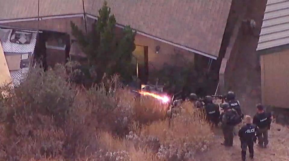 PHOTO: Police fire into a house as they look for missing couple, Stephanie Menard, 73, and her husband, Daniel, 79 in Redlands, Calif. (KABC)