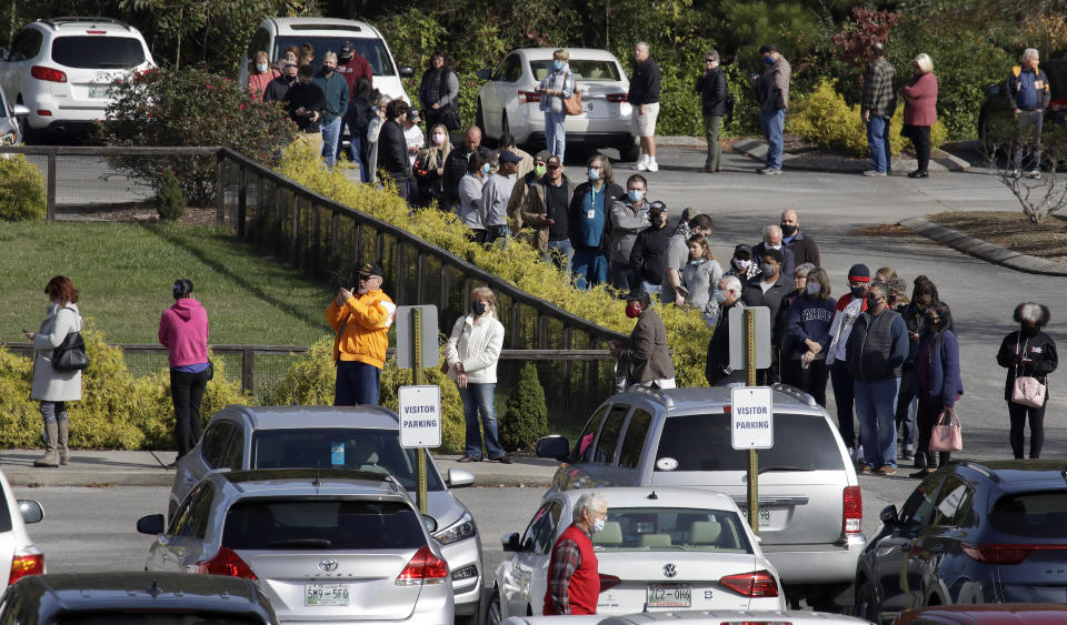 Voters wait in line outside the Covenant Presbyterian Church to cast their ballots, Tuesday, Nov. 3, 2020, in Chattanooga, Tenn. (AP Photo/Ben Margot)