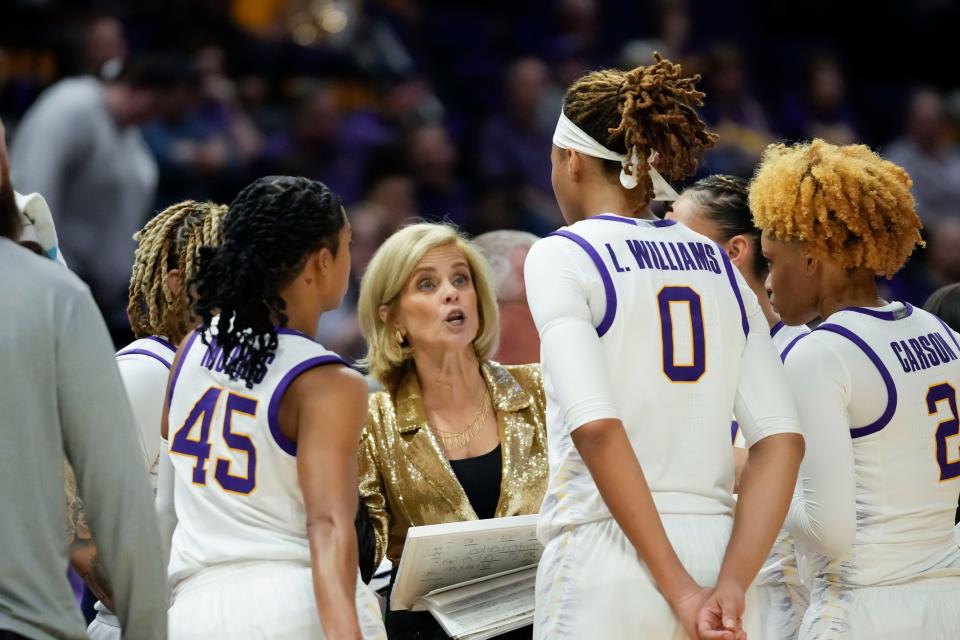 LSU head coach Kim Mulkey talks to her team in the first half an NCAA college basketball game against Arkansas in Baton Rouge, La., Thursday, Jan. 19, 2023. (AP Photo/Gerald Herbert)