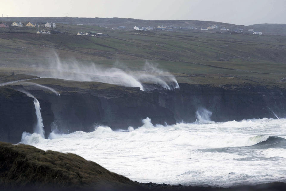 Water is blown back on to the land near Doolin, Co Clare, as Storm Eunice continues to rage across Ireland, Friday, Feb. 18, 2022. Britain’s weather service said Storm Eunice, known as Storm Zeynep in Germany, was likely to cause significant disruption and dangerous conditions, with gusts that may exceed 90 miles per hour in highly exposed coastal areas. (Eamon Ward/PA via AP)