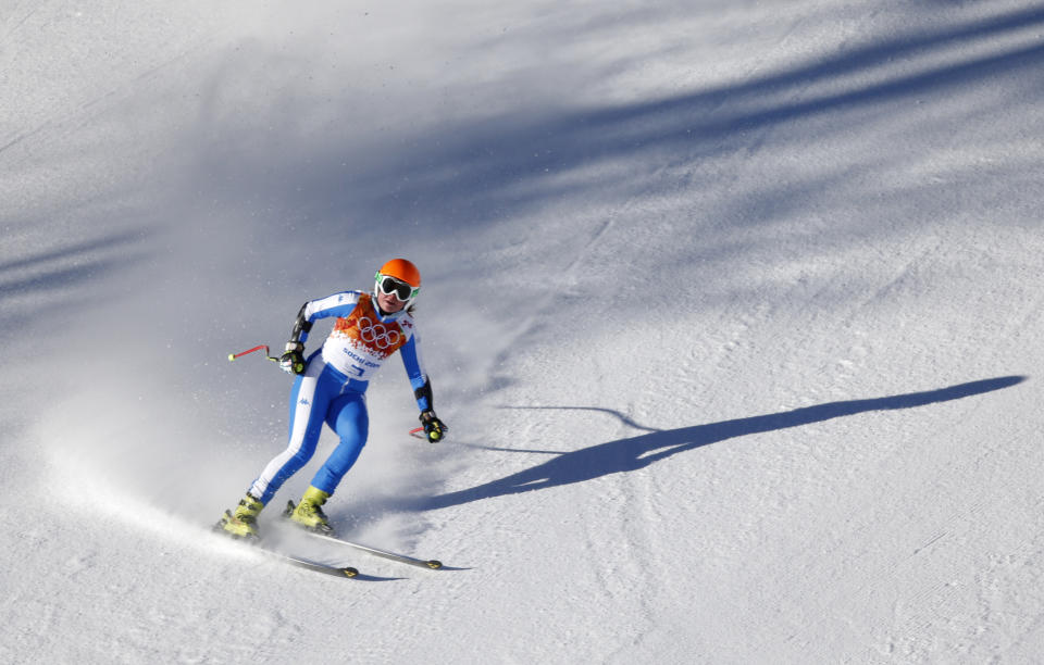 Italy's Verena Stuffer comes to a halt in the finish area after completing a women's downhill training run at the Sochi 2014 Winter Olympics, Thursday, Feb. 6, 2014, in Krasnaya Polyana, Russia. (AP Photo/Christophe Ena)