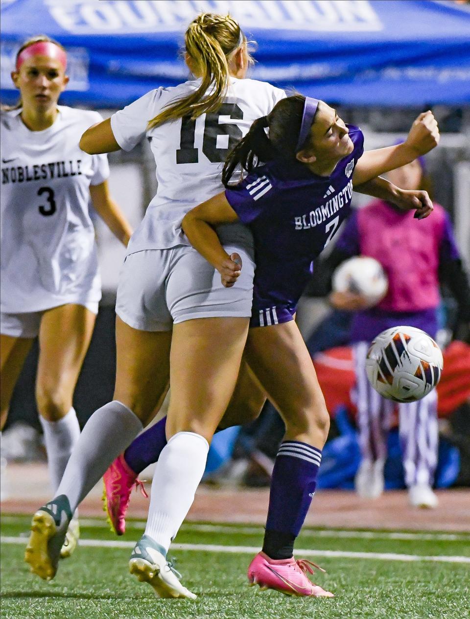 Bloomington South’s Helena Cutshall (7) and Noblesville’s Ashlyn McNitt (16) battle for possession of the ball during the IHSAA girls’ soccer state championship match at Michael Carroll Track & Soccer Stadium in Indianapolis, Ind. on Saturday, Oct. 28, 2023.
