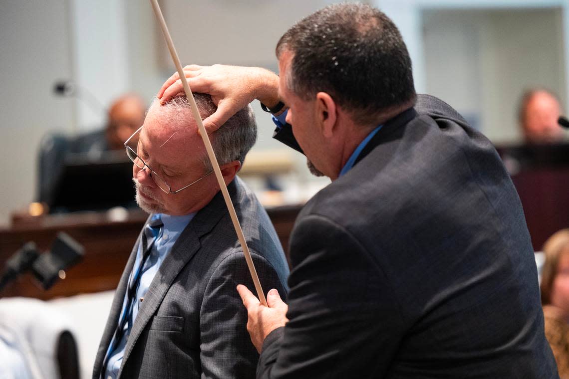 Kenneth Kinsey, crime scene specialist, shows where he believes a shotgun round entered Paul Murdaugh during Alex Murdaugh’s trial for murder at the Colleton County Courthouse on Thursday, Feb. 16, 2023. Joshua Boucher/The State/Pool