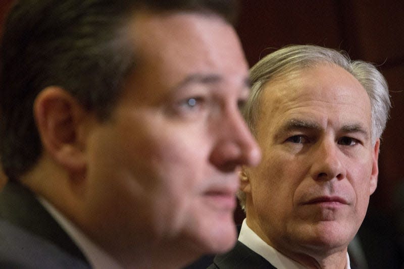 Texas Gov. Greg Abbott. right, listens to Republican presidential candidate Sen. Ted Cruz, R-Texas, left, speak about the resettlement of Syrian refugees in the U.S., during their joint news conference on Capitol Hill in Washington, Tuesday, Dec. 8, 2015. Abbott was in Washington with Cruz to support a bill Cruz has introduced in Congress banning any refugees from Iraq, Syria or other countries deemed to be controlled by a foreign terrorist organization. (AP Photo/Pablo Martinez Monsivais)