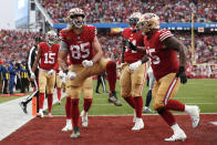 San Francisco 49ers tight end George Kittle (85) celebrates after scoring on a two point conversion during the second half of an NFL wild card playoff football game against the Seattle Seahawks in Santa Clara, Calif., Saturday, Jan. 14, 2023. (AP Photo/Jed Jacobsohn)