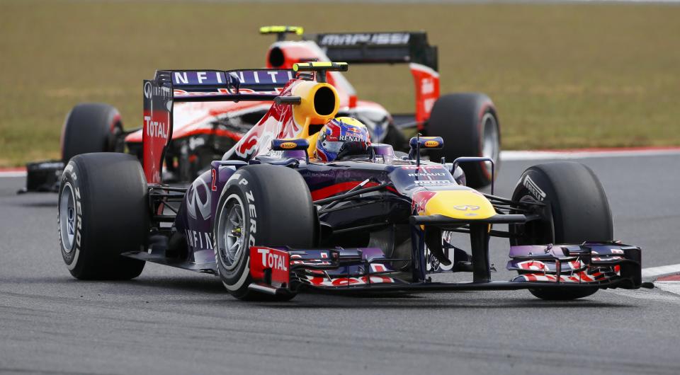 Red Bull Formula One driver Mark Webber of Australia (front) races ahead of Marussia Formula One driver Max Chilton of Britain during the qualifying session for the Korean F1 Grand Prix at the Korea International Circuit in Yeongam, October 5, 2013. REUTERS/Kim Hong-Ji (SOUTH KOREA - Tags: SPORT MOTORSPORT F1)