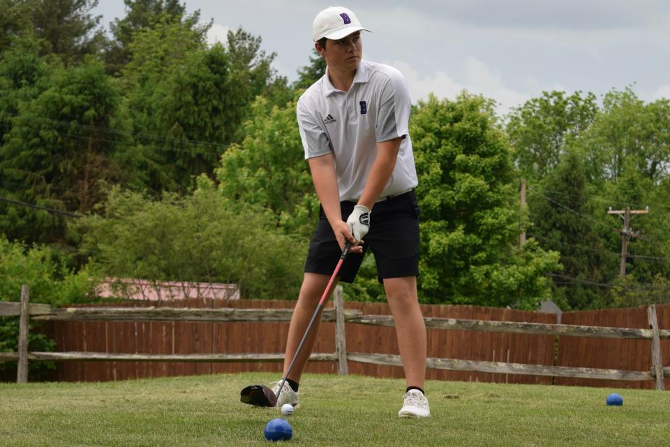 Bloomington South junior Nick Bellush prepares to tee off on an early hole during the Cougars' dual match against Bloomington South at Cascades Golf Course on May 19, 2022. The match was later suspended due to inclement weather. (Seth Tow/Herald-Times)