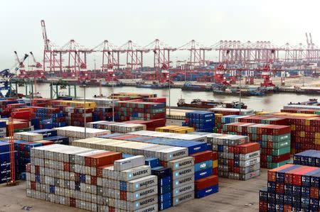 FILE PHOTO: Shipping containers are seen at Nansha terminal of Guangzhou port, in Guangdong province, China June 14, 2017. REUTERS/Stringer