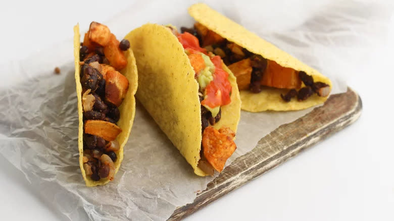 Tacos with black beans, sweet potatoes, guac