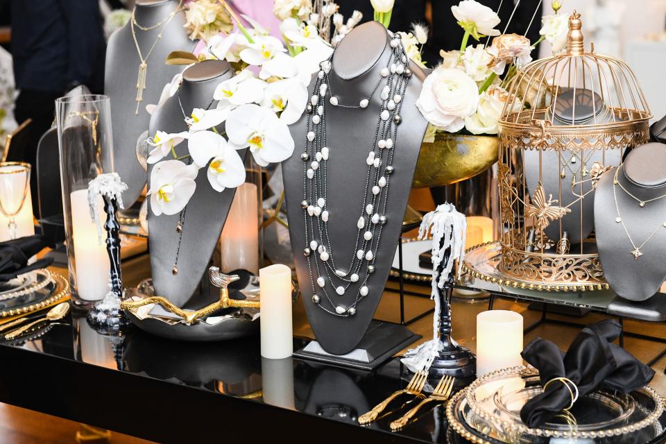 <h1 class="title">The romantic tablescape featuring Ilene Joy's layered pearl necklace amongst orchids and dripping candles.</h1><cite class="credit">Photo: Joe Schildhorn / BFA</cite>