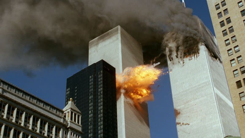 In this Sept. 11, 2001, file photo, United Airlines Flight 175 collides into the south tower of the World Trade Center in New York as smoke billows from the north tower from the first airliner strike.
