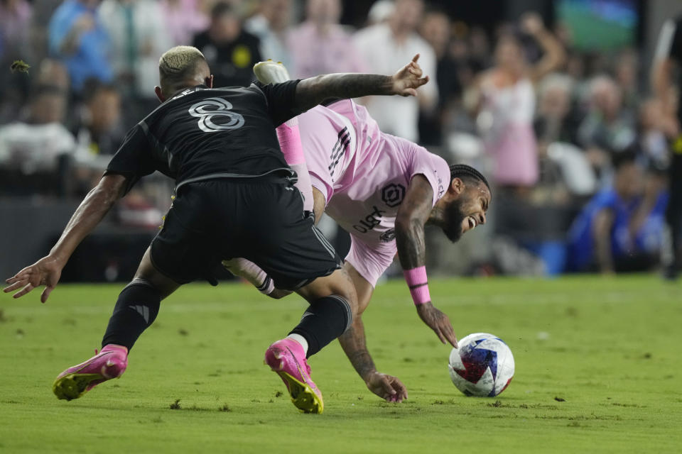 Nashville SC midfielder Randall Leal (8) defends Inter Miami defender DeAndre Yedlin during the first half of an MLS soccer match, Wednesday, Aug. 30, 2023, in Fort Lauderdale, Fla. (AP Photo/Marta Lavandier)