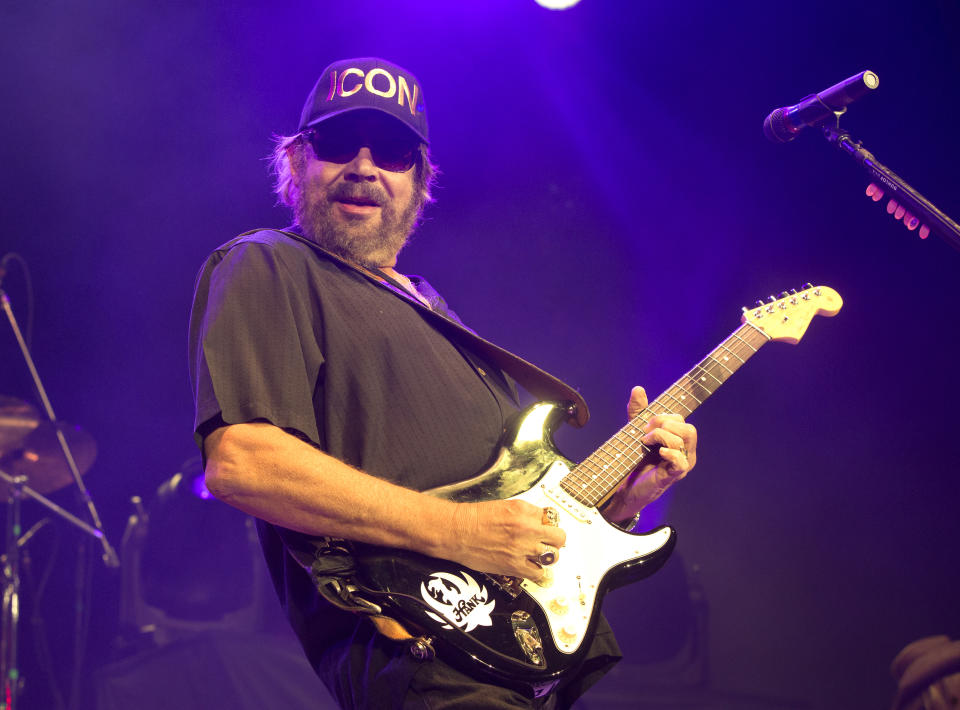 FILE - Hank Williams, Jr. performs in concert at The BB&T Pavilion in Camden, N.J. on Aug. 19, 2017. Williams, along with Dean Dillon and Marty Stuart, will be inducted into the Country Music Hall of Fame. (Photo by Owen Sweeney/Invision/AP, File)