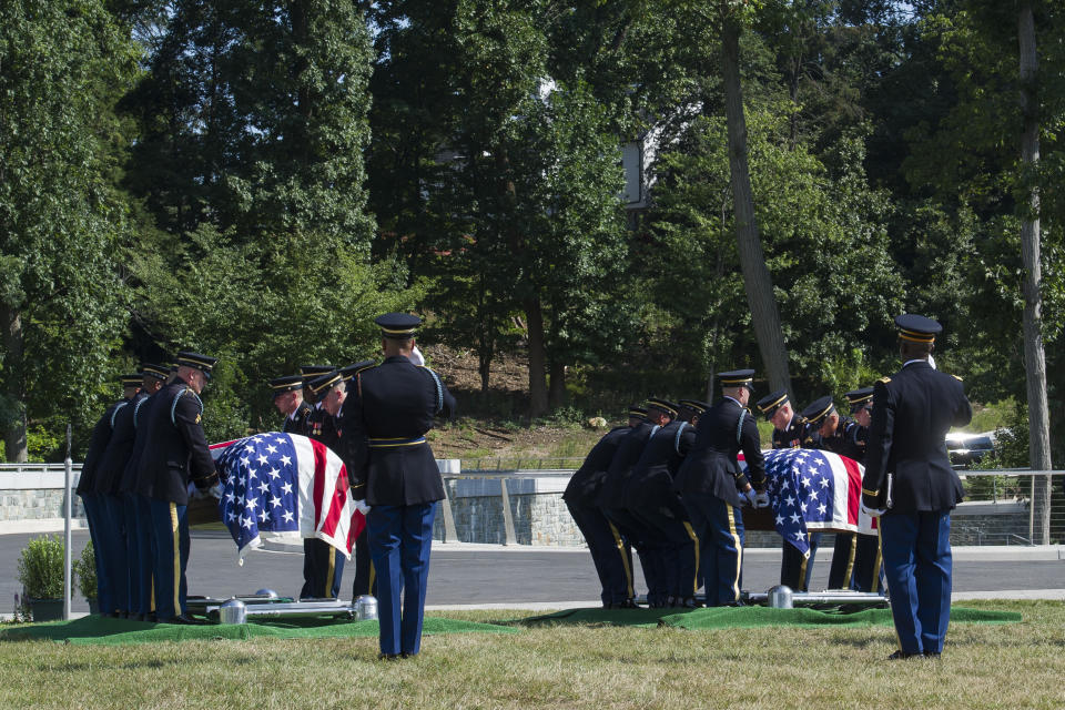 The 3rd Infantry Regiment, also known as the Old Guard, casket teams place the remains of two unknown Civil War Union soldiers at their graves at Arlington National Cemetery in Arlington, Va.,Thursday, Sept. 6, 2018. The soldiers were discovered at Manassas National Battlefield and will be buried in Section 81. Arlington National Cemetery opened the new section of gravesites with the burial. (AP Photo/Cliff Owen)