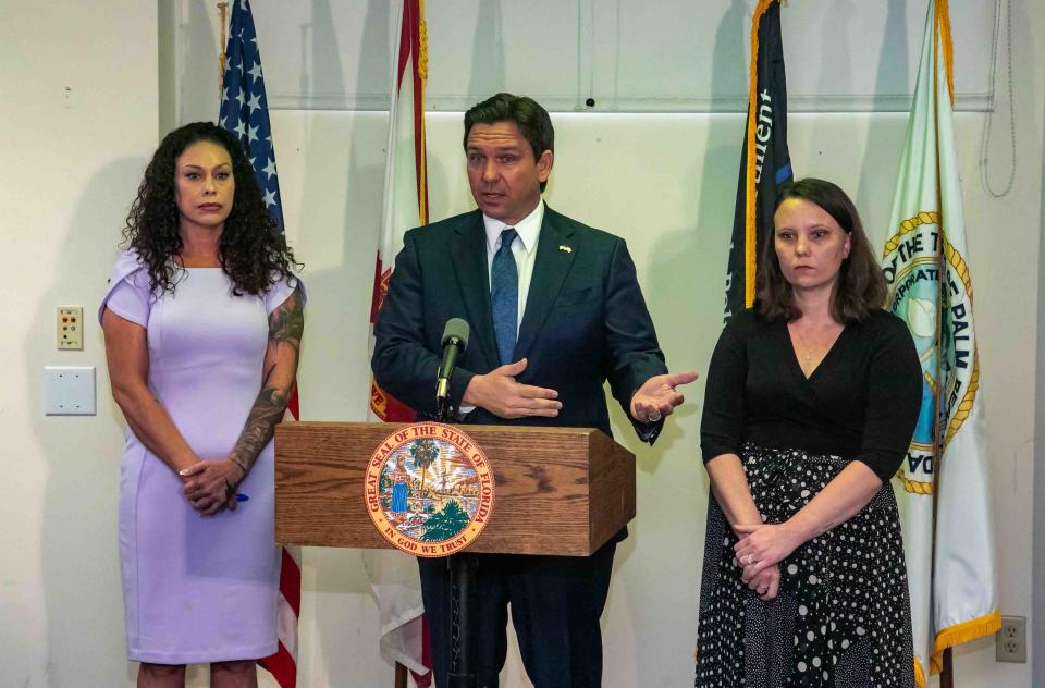 Gov. Ron DeSantis and Jeffrey Epstein victims Hayley Robson, left, and Jena-Lisa Jones answer questions about the bill after it was signed.