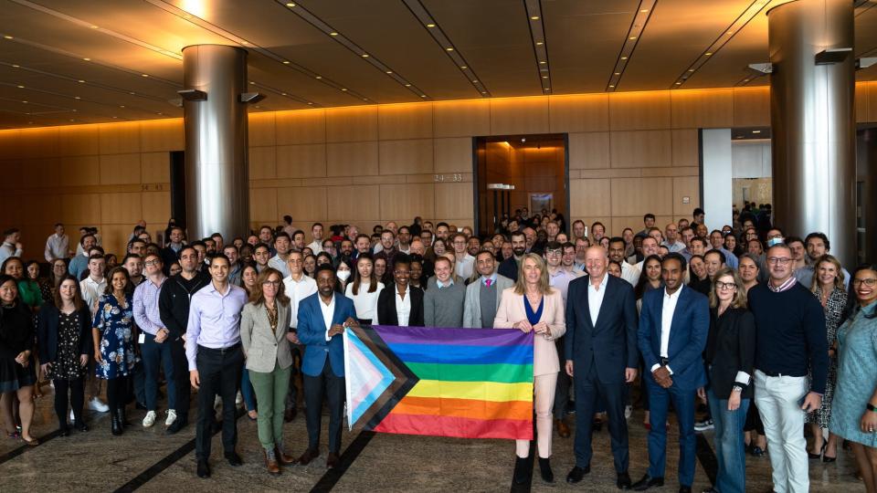 Goldman Sachs CEO David M. Solomon (fifth from right) poses with LGBTQ+ employees for Transgender Day of Visibility.