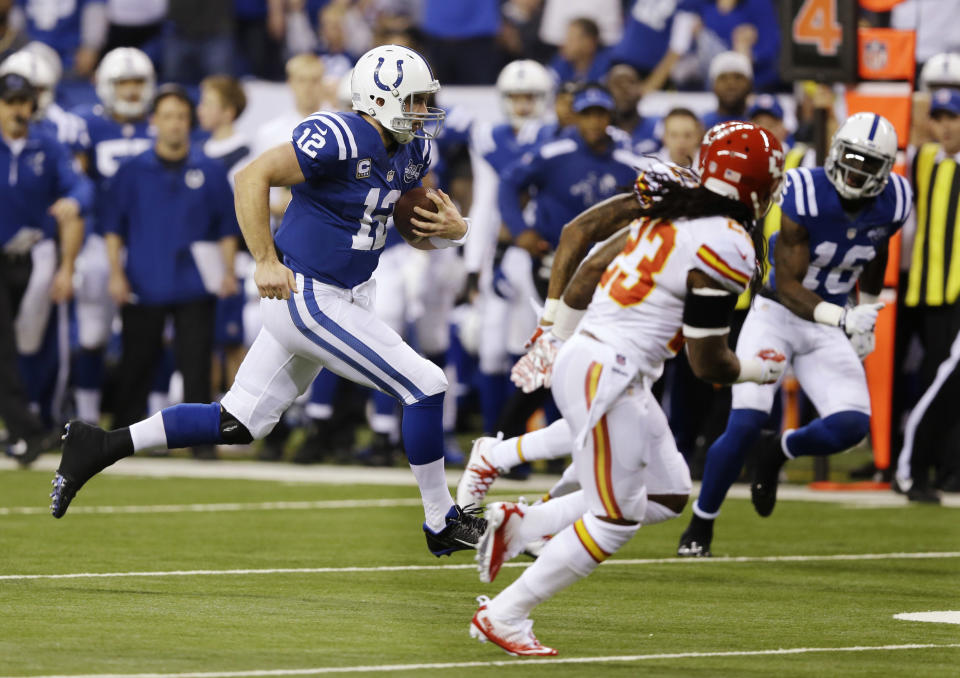 Indianapolis Colts' Andrew Luck (12) runs during the first half of an NFL wild-card playoff football game against the Kansas City Chiefs Saturday, Jan. 4, 2014, in Indianapolis. (AP Photo/Michael Conroy)