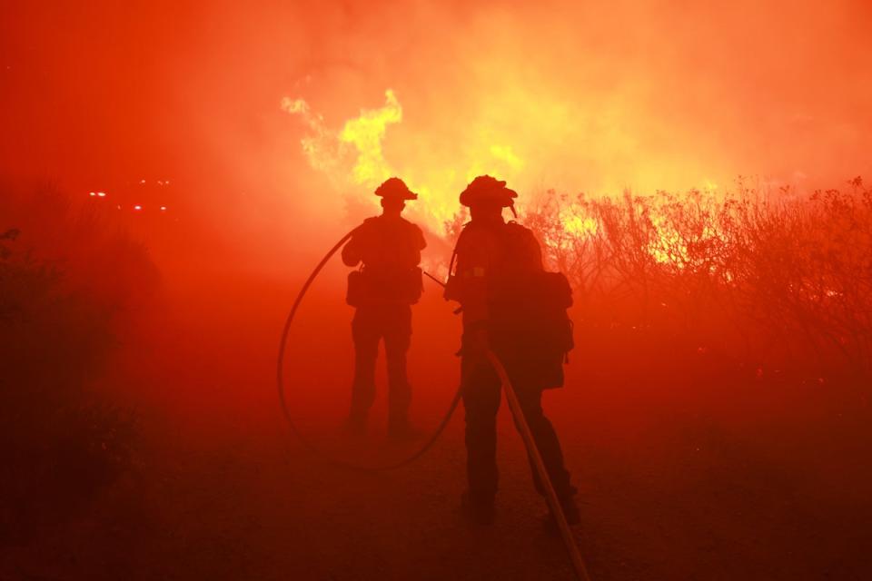 Firefighters pictured responding to the Post Fire in southern California, which has burned through more than 15,000 acres as of Tuesday (AFP via Getty Images)