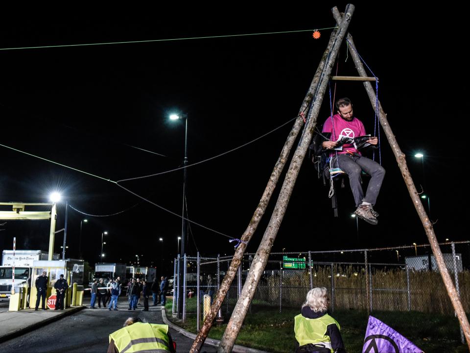 Environmental activist group Extinction Rebellion sets up a blockade in front of the New York Times printing plant (Getty Images)