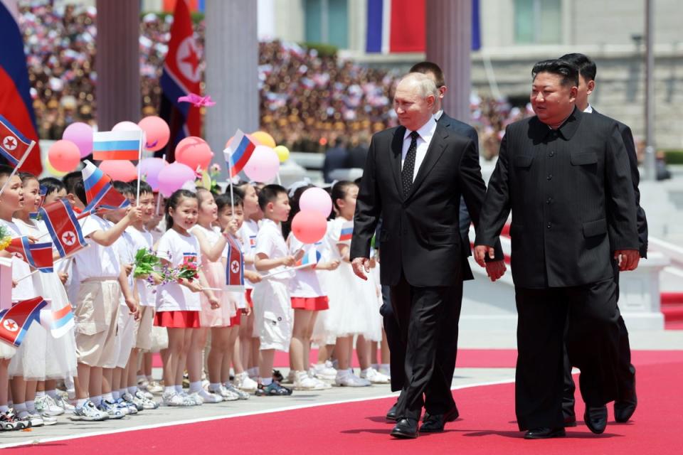 Russian and North Korean leader greet crowd (EPA)