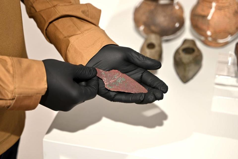 Piotr Gorlach holds the 4,000-year-old dagger he found in Korzenica.