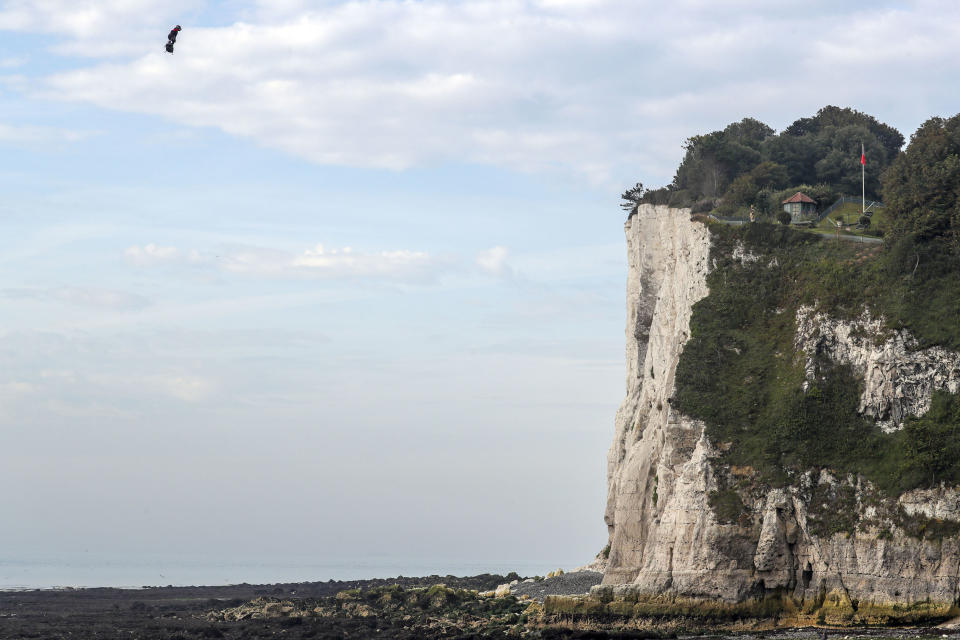 French inventor Franky Zapata lands near St. Margaret's beach, Dover after crossing the Channel on a flying board Sunday, Aug. 4, 2019. (Steve Parsons/PA via AP)