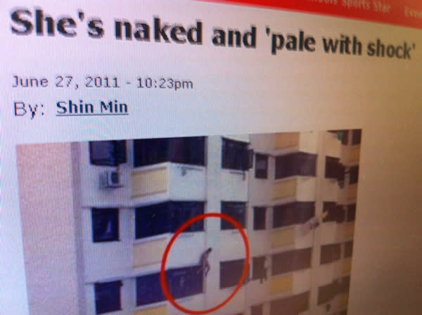 A naked woman sat on a window ledge of a block in Toa Payoh. (Screencap)