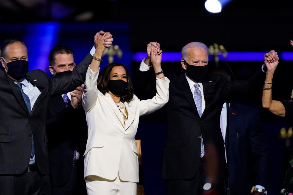 President-elect Joe Biden, his wife, Jill Biden, and members of the Biden family, along with Vice President-elect Kamala Harris and her husband, Doug Emhoff, stand on stage Nov. 7 in Wilmington, Delaware.