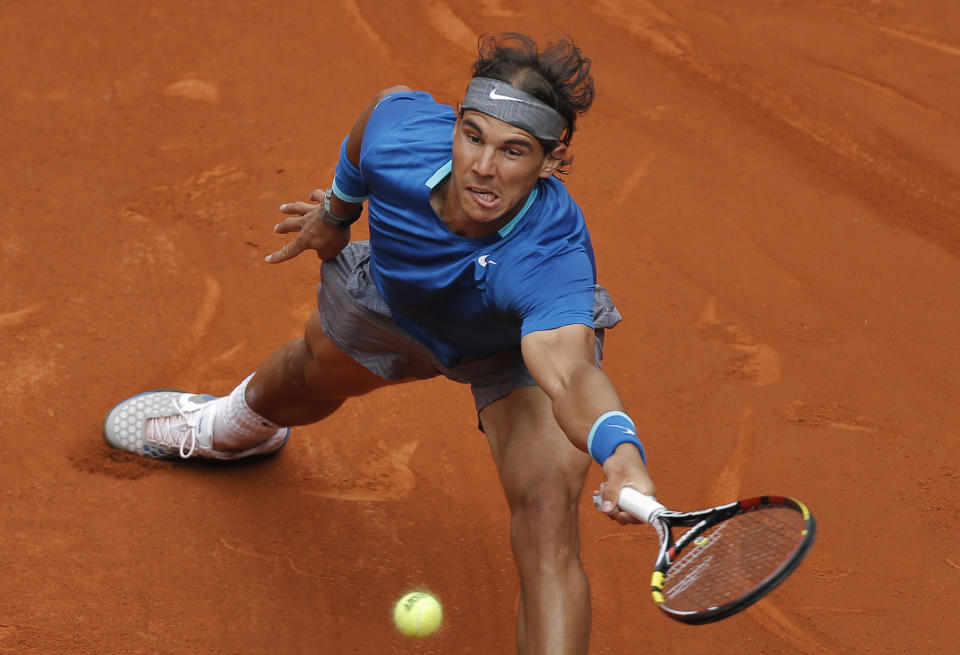 Rafael Nadal from Spain returns the ball during a Madrid Open tennis tournament match against Juan Monaco from Argentina, in Madrid, Spain, Wednesday, May 7, 2014. (AP Photo/Andres Kudacki)