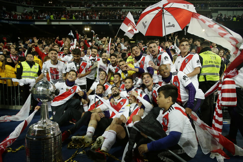 Players of Argentina's River Plate celebrate after defeating Argentina's Boca Juniors in the Copa Libertadores final soccer match at the Santiago Bernabeu stadium in Madrid, Spain, Sunday, Dec. 9, 2018. (AP Photo/Manu Fernandez)