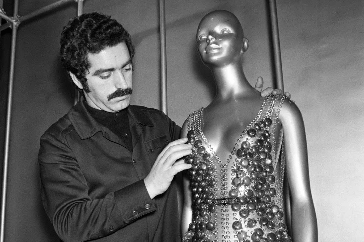 Paco Rabanne working in 1970  on a dress for his Spring-Summer collection in Paris (AFP via Getty Images)