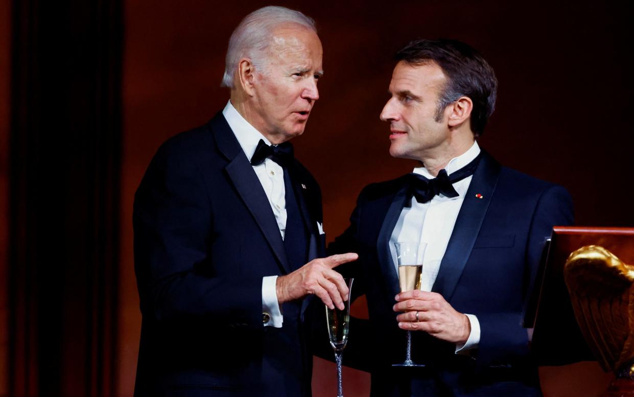 US president Joe Biden and French president Emmanuel Macron during a toast at a state dinner at the White House - Reuters