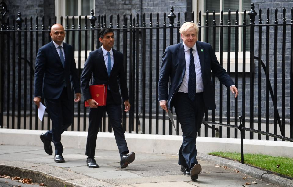 Health Secretary Sajid Javid, Chancellor of the Exchequer Rishi Sunak and Prime Minister Boris Johnson in 2021.