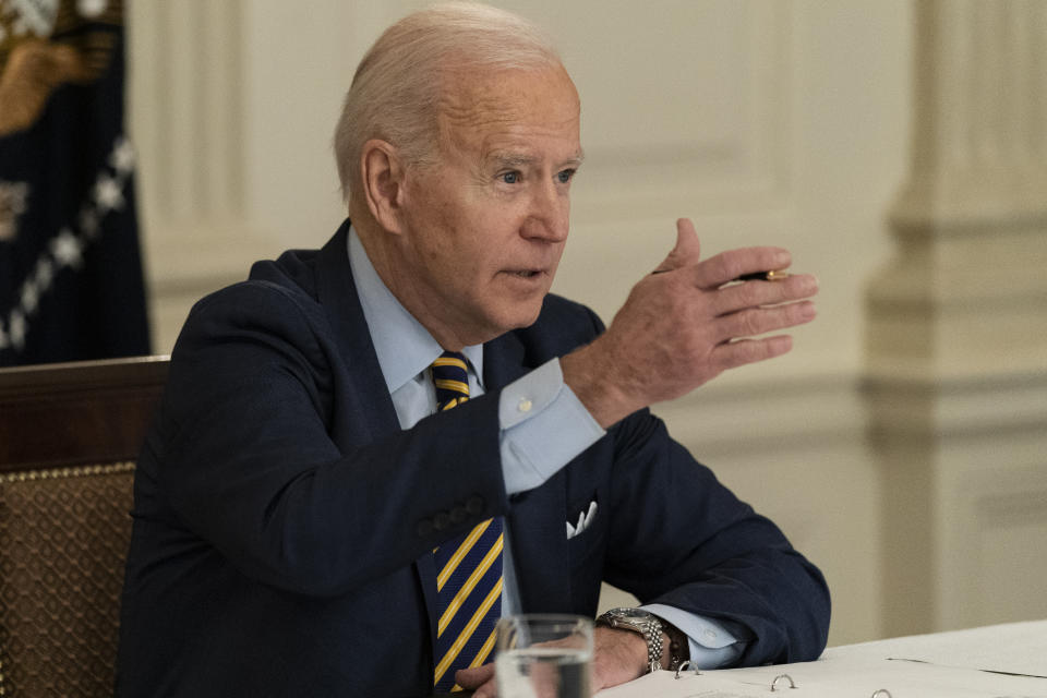 President Joe Biden speaks during a virtual meeting with Indian Prime Minister Narendra Modi, Australian Prime Minister Scott Morrison and Japanese Prime Minister Yoshihide Suga, from the State Dining Room of the White House, Friday, March 12, 2021, in Washington. (AP Photo/Alex Brandon)