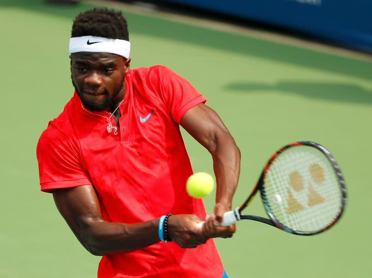 Frances Tiafoe returns a backhand to John Millman of Australia during the BB&T Atlanta Open at Atlantic Station on July 25, 2017 in Atlanta, Georgia