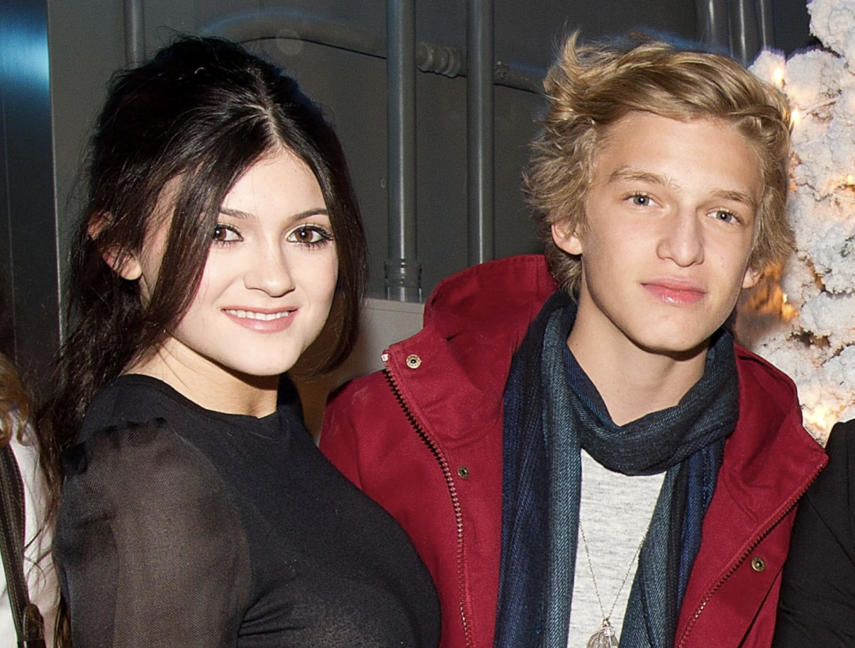 UNIVERSAL CITY, CA - DECEMBER 06: Pop! Magazine Editor in Chief Matthew Rettenmund poses with reality TV stars Kylie and Kendall Jenner (L, R) and singer Cody Simpson at Teen Sensations Invade Buca di Beppo For Popstar! Magazine's 