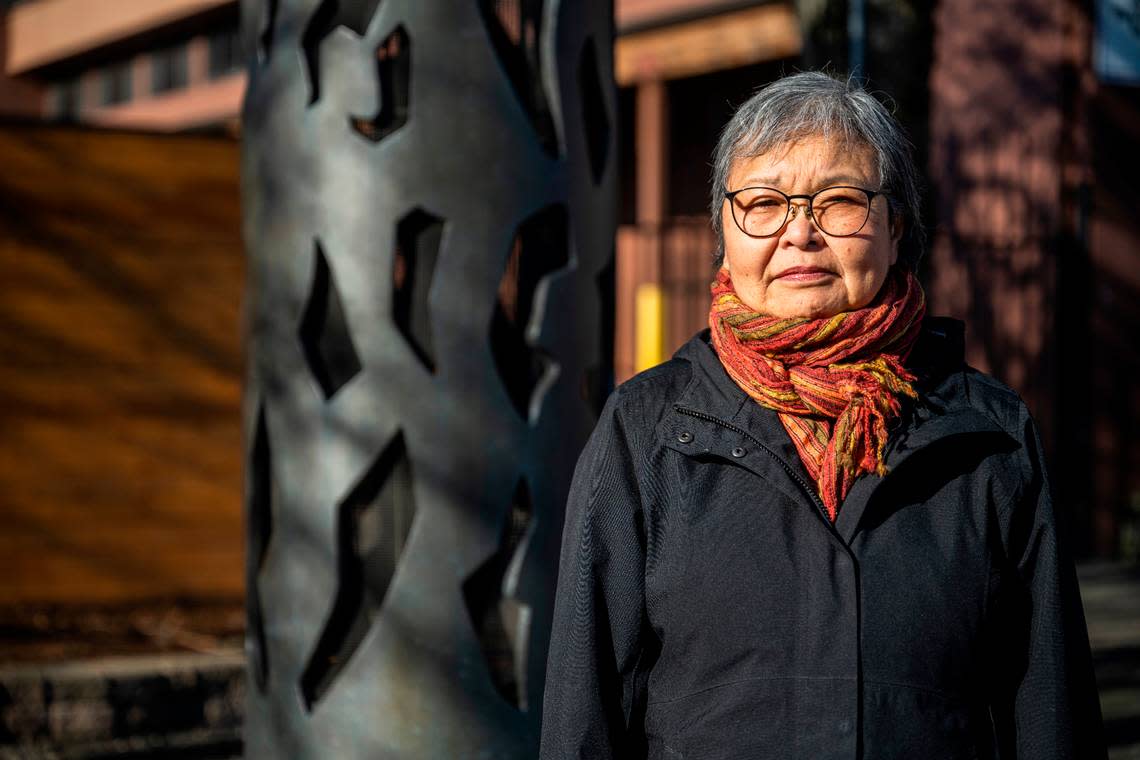 Mary Tanaka Abo, 82, poses for a portrait next to the statue, “Harmony,” that was created by Japanese American artist George Tsutakawa, to honor the people of Japanese ancestry that were incarcerated on the Washington State Fair grounds in Puyallup, Wash. during WWII, on Feb. 1, 2023. Abo was two-years-old when she and her family were forced to live at the camp after being removed from their home in Juneau, Alaska in 1942. The Puyallup Valley Japanese American Citizens League plans to build a remembrance gallery under the grandstands of the Washington State Fair to honor all of the Japanese American people who were incarcerated at the “Puyallup Assembly Center” or “Camp Harmony” during WWII.